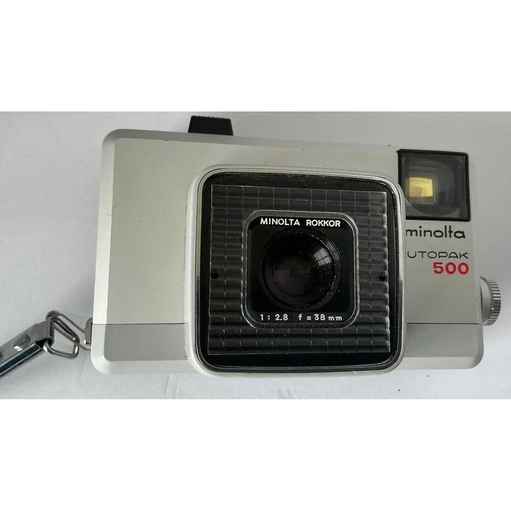 Minolta Vintage Autopak 500 Film Camera Rokkor 38mm f/2.8 Lens Silver Black Retr